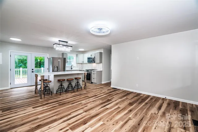 a open kitchen with a table and chairs in it