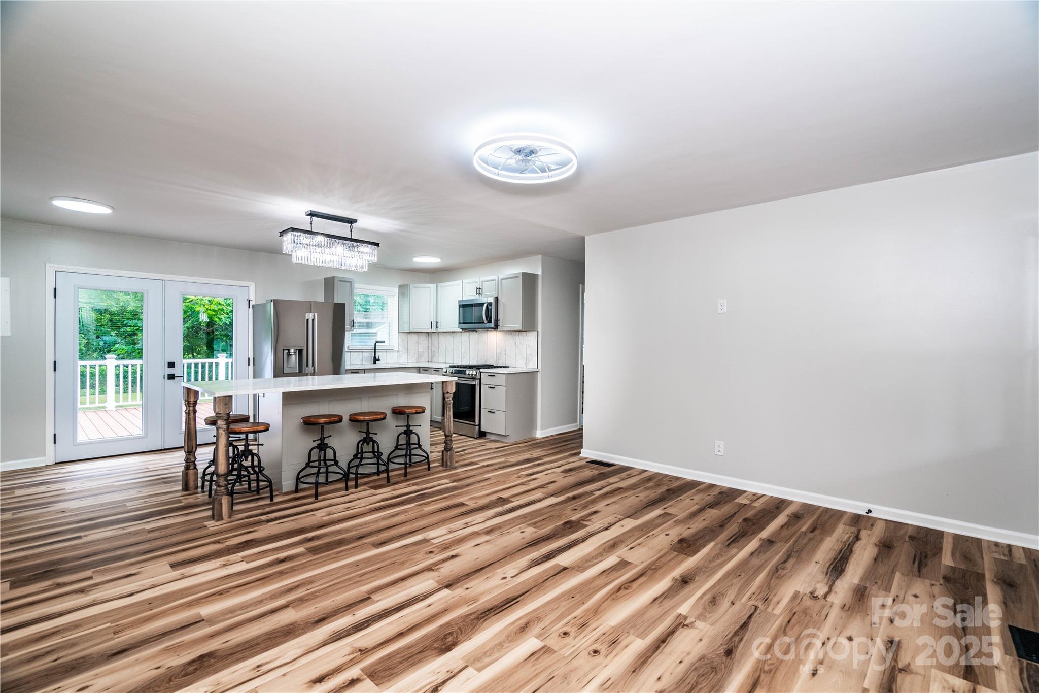 305 Linden Circle Gastonia, NC 28054 - Photo 3 of 37 a open kitchen with a table and chairs in it