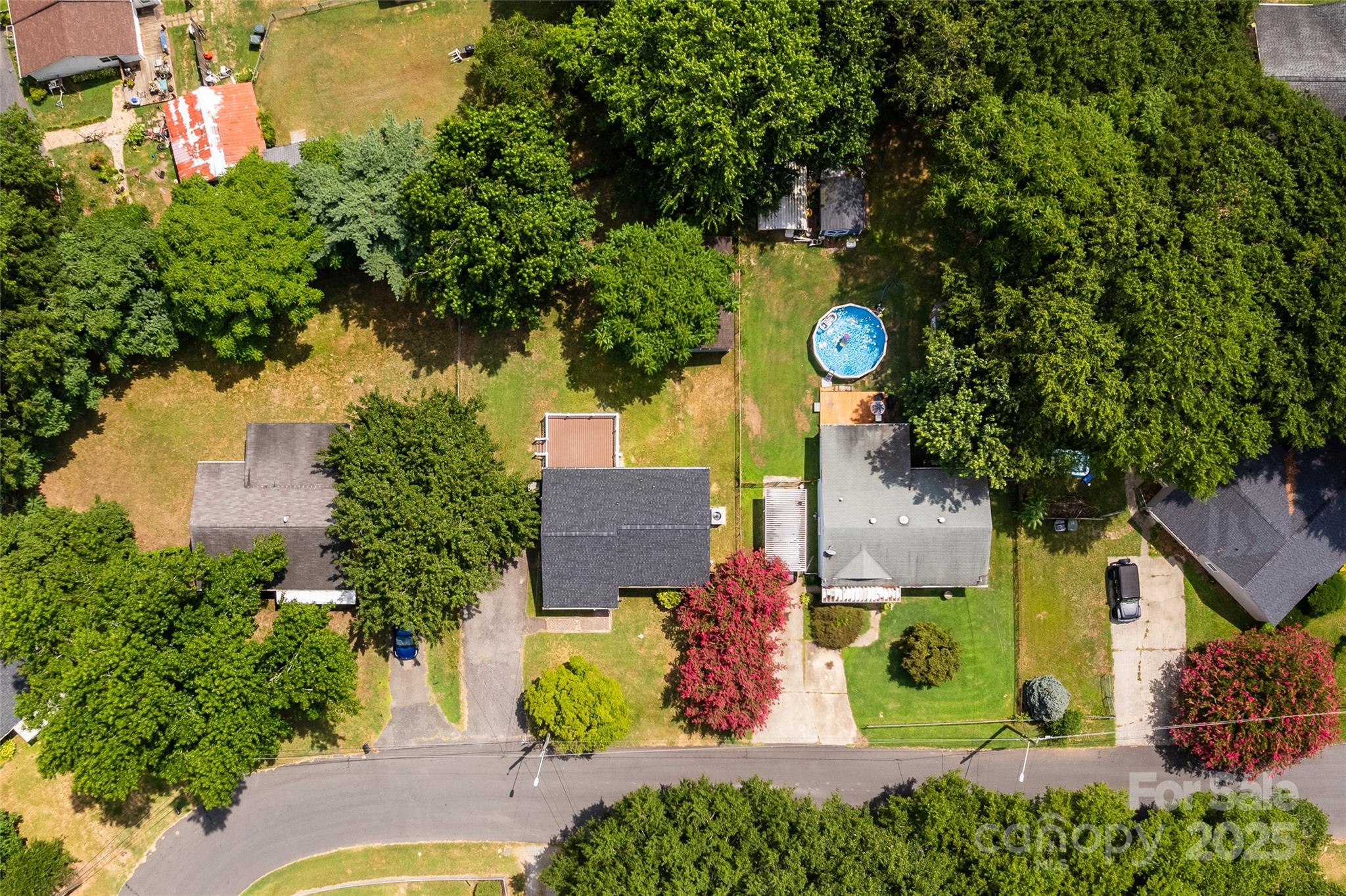 305 Linden Circle Gastonia, NC 28054 - Photo 31 of 37 an aerial view of a house with a yard and outdoor seating