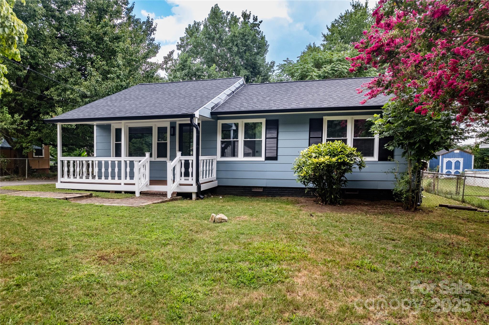 305 Linden Circle Gastonia, NC 28054 - Photo 33 of 37 a front view of a house with a garden