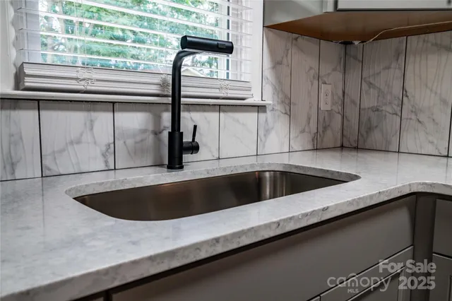 a view white cabinets and sink