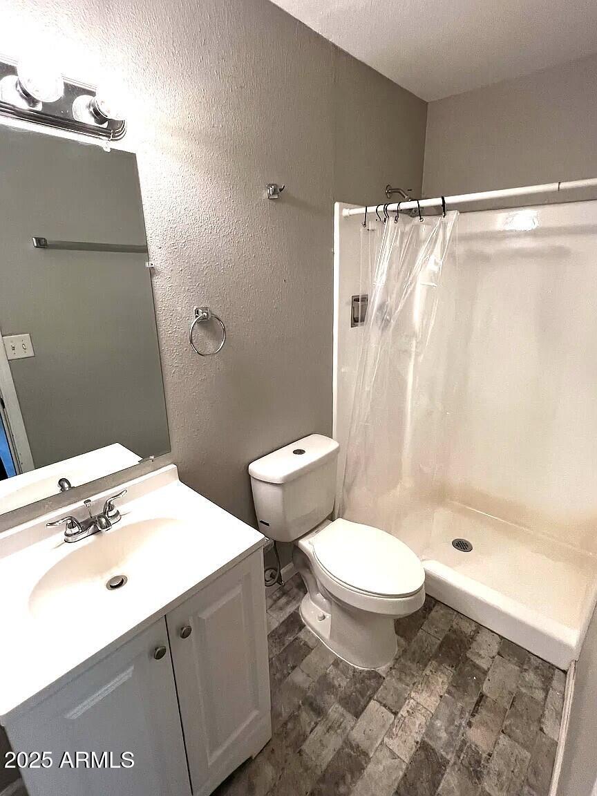 4505 North 17th Avenue Phoenix, AZ 85015 - Photo 3 of 12 a bathroom with a sink toilet and shower