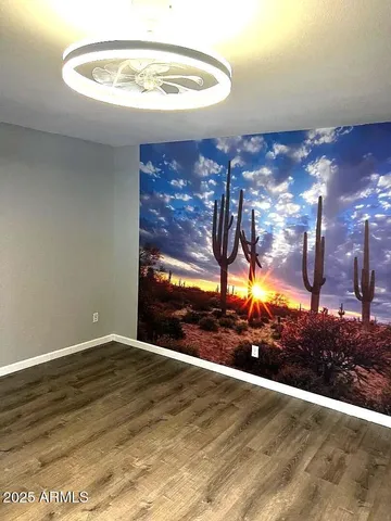 a view of a room with a wooden floor