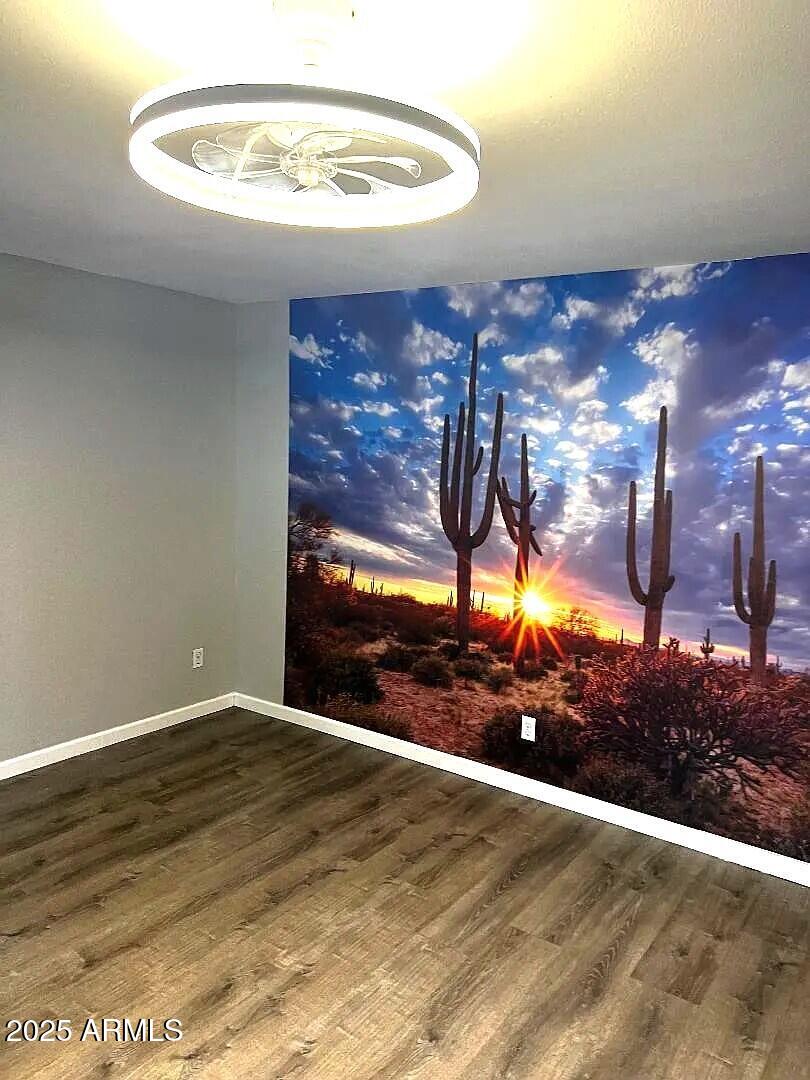 4505 North 17th Avenue Phoenix, AZ 85015 - Photo 6 of 12 a view of a room with a wooden floor
