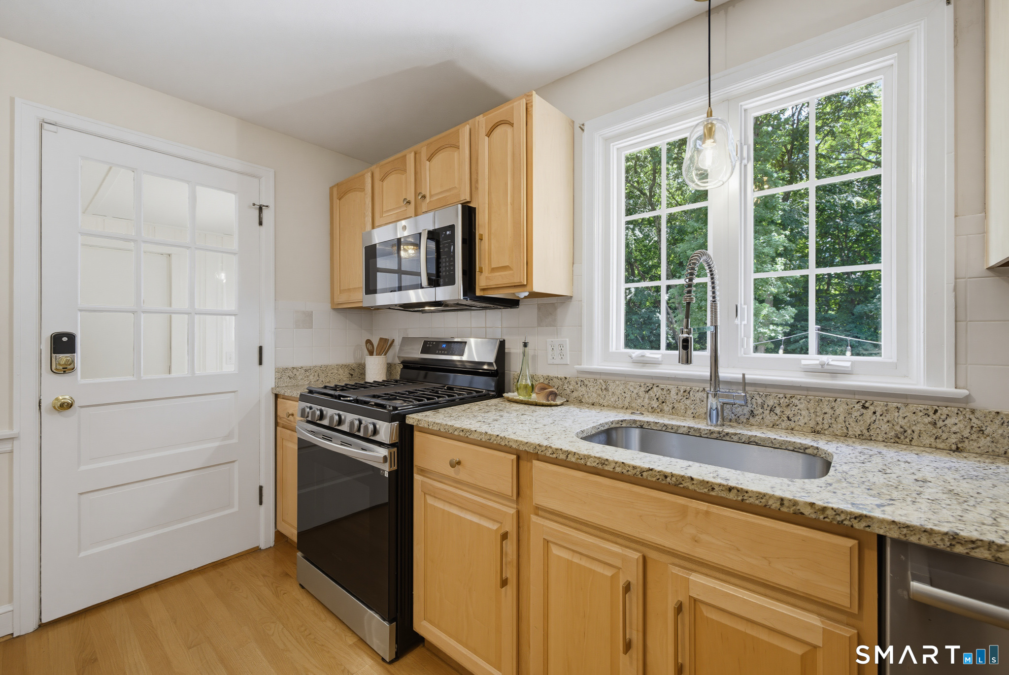 224 Spring Street Manchester, CT 06040 - Photo 11 of 39 a kitchen with stainless steel appliances granite countertop a sink stove and cabinets