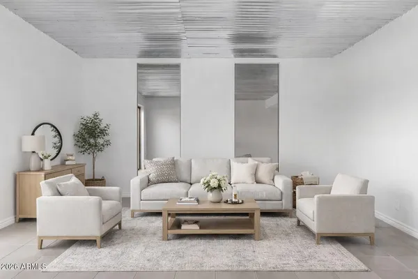 a living room with furniture and white walls