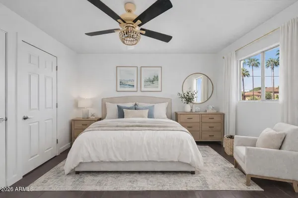 a bedroom with a large bed and window