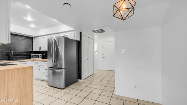 a kitchen with stainless steel appliances a refrigerator and a sink