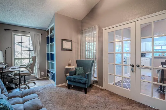 a living room with furniture and windows