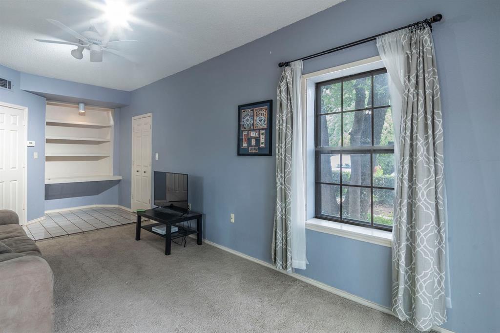 4516 Forestgate Drive Arlington, TX 76017 - Photo 16 of 23 a view of a livingroom with workspace and a window