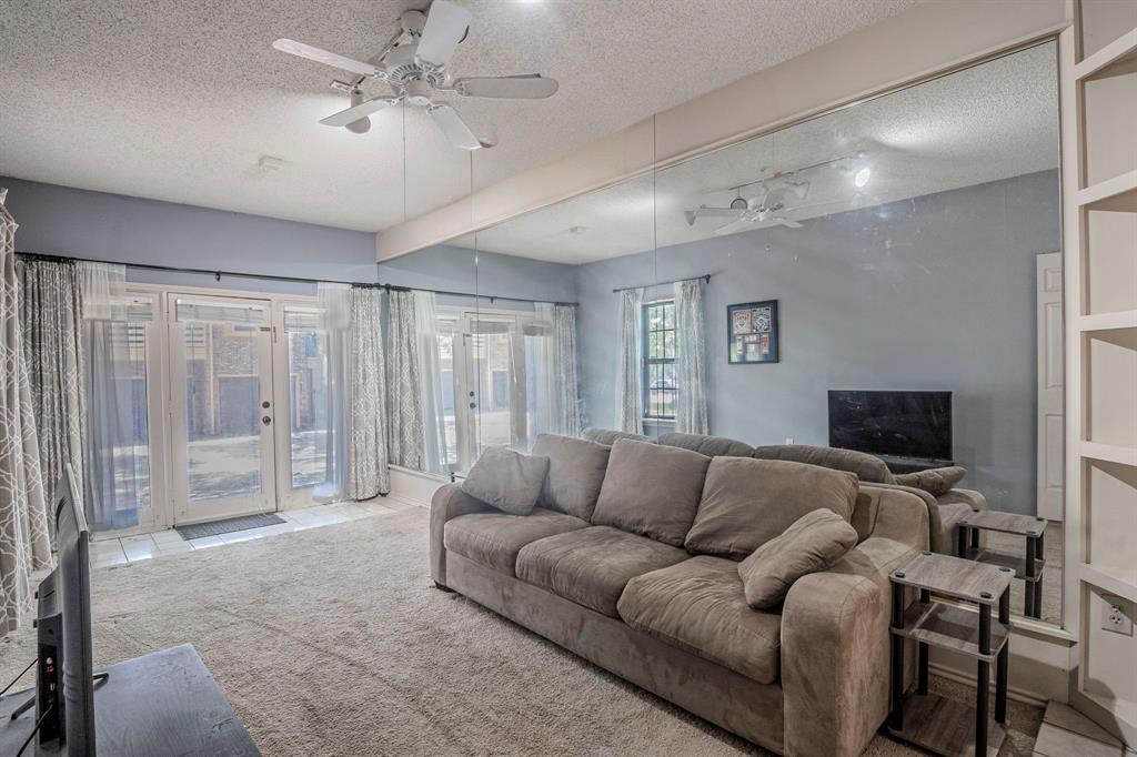 4516 Forestgate Drive Arlington, TX 76017 - Photo 17 of 23 a living room with furniture and a flat screen tv