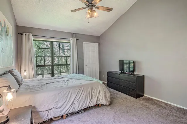 a bedroom with a bed and window