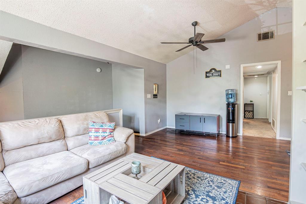 4516 Forestgate Drive Arlington, TX 76017 - Photo 6 of 23 a living room with furniture and a wooden floor