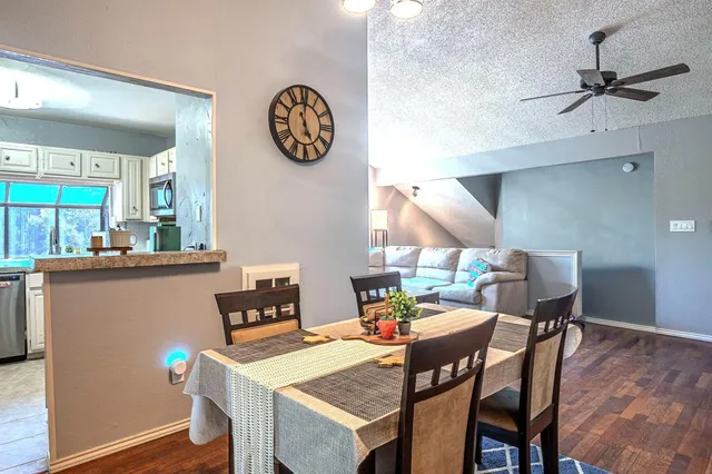 a view of a dining room with furniture and a window
