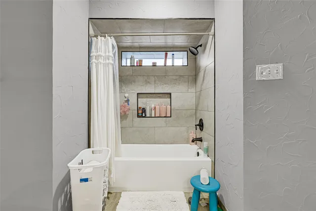a view of staircase with wooden floor and fan