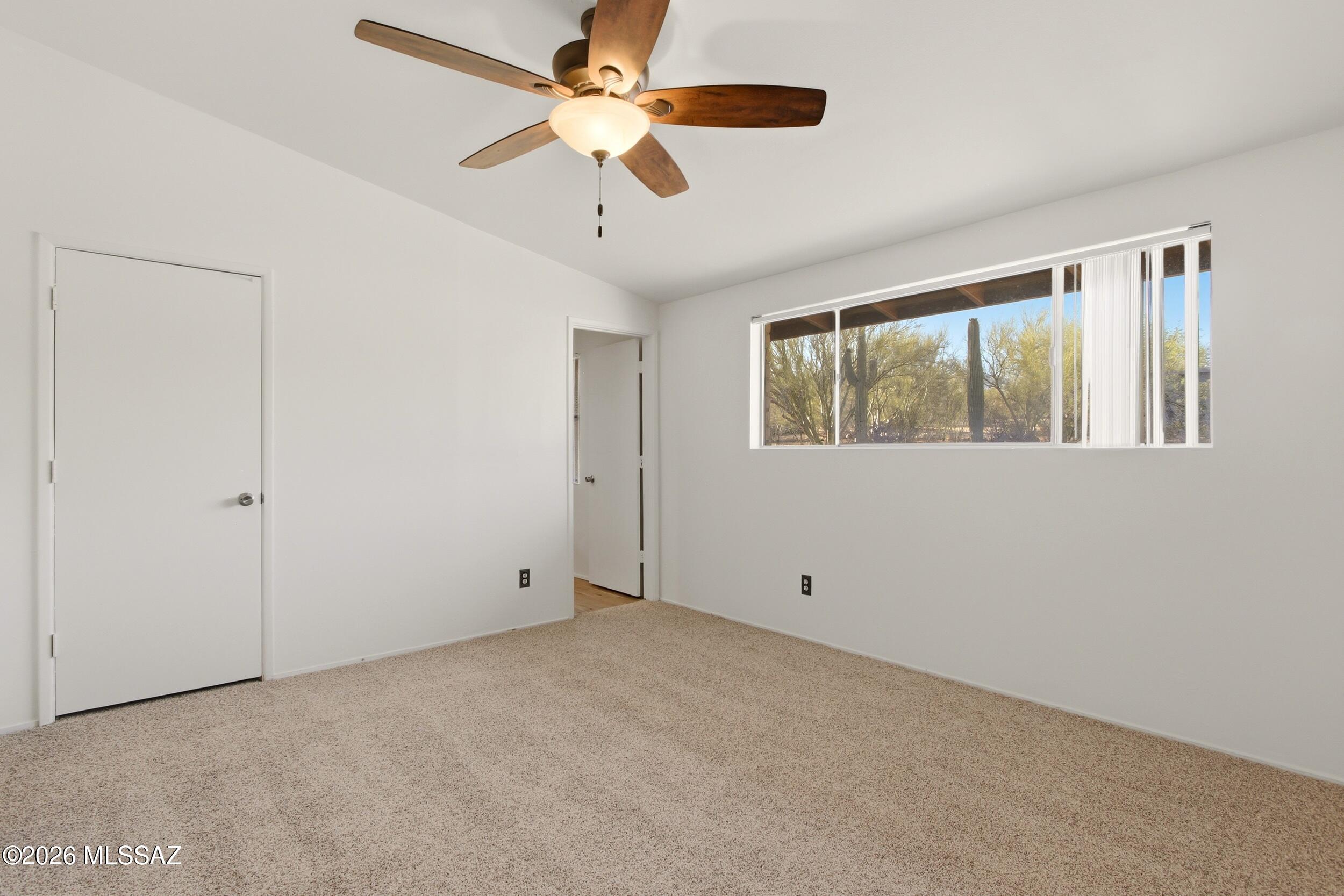 9141 East Indian Canyon Road Tucson, AZ 85749 - Photo 17 of 33 a view of an empty room with a window