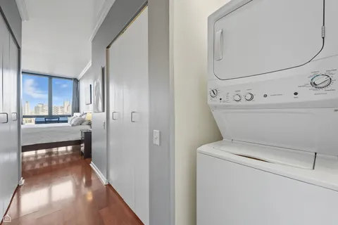 a view of washer and dryer with bathroom