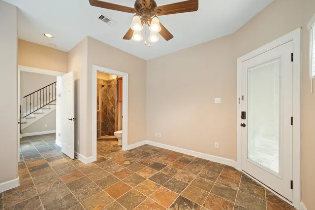 a view of an empty room with glass door