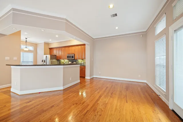 a view of walk in closet with empty racks