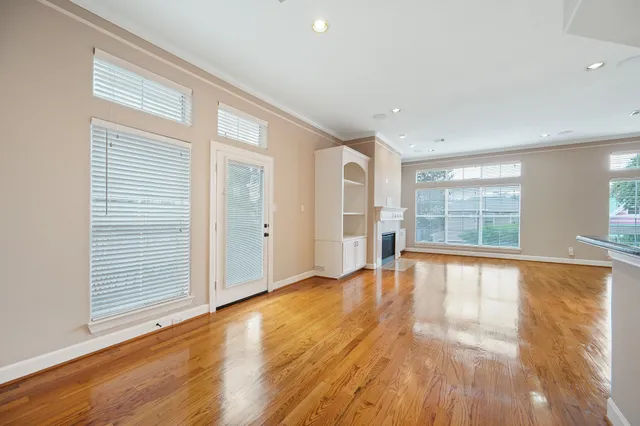 a view of an empty room with a ceiling fan