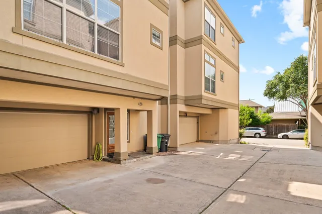 a view of a building with car parked
