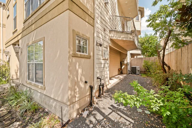 a view of staircase with wooden floor and white walls