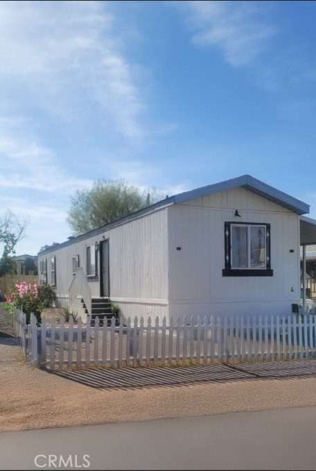 a view of a house with a small yard