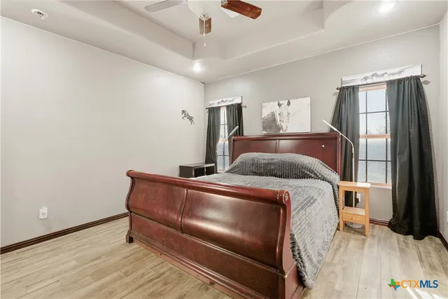 a bed room with a bed and a window