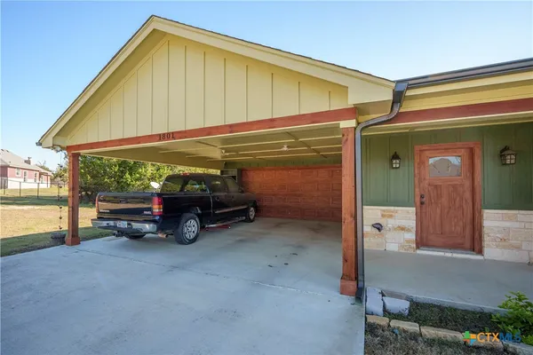 a view of car parked in front of house