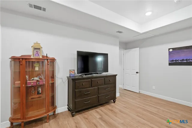 a room with furniture and flat screen tv