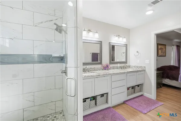 a bathroom with a sink a vanity and a mirror
