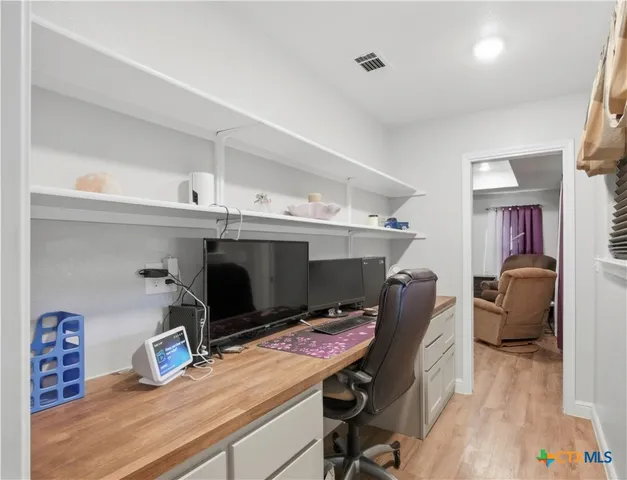 a room with furniture and a wooden floor