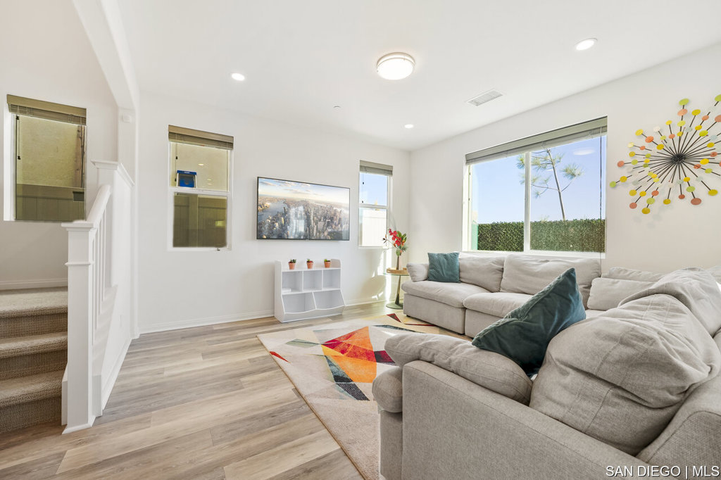 8615 Chaparral Way Santee, CA 92071 - Photo 11 of 46 a living room with furniture and a window