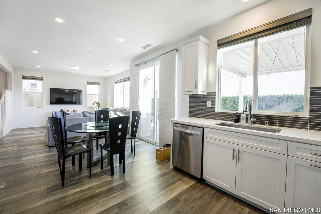 8615 Chaparral Way Santee, CA 92071 - Photo 13 of 46 a kitchen with lots of counter top space and dining table