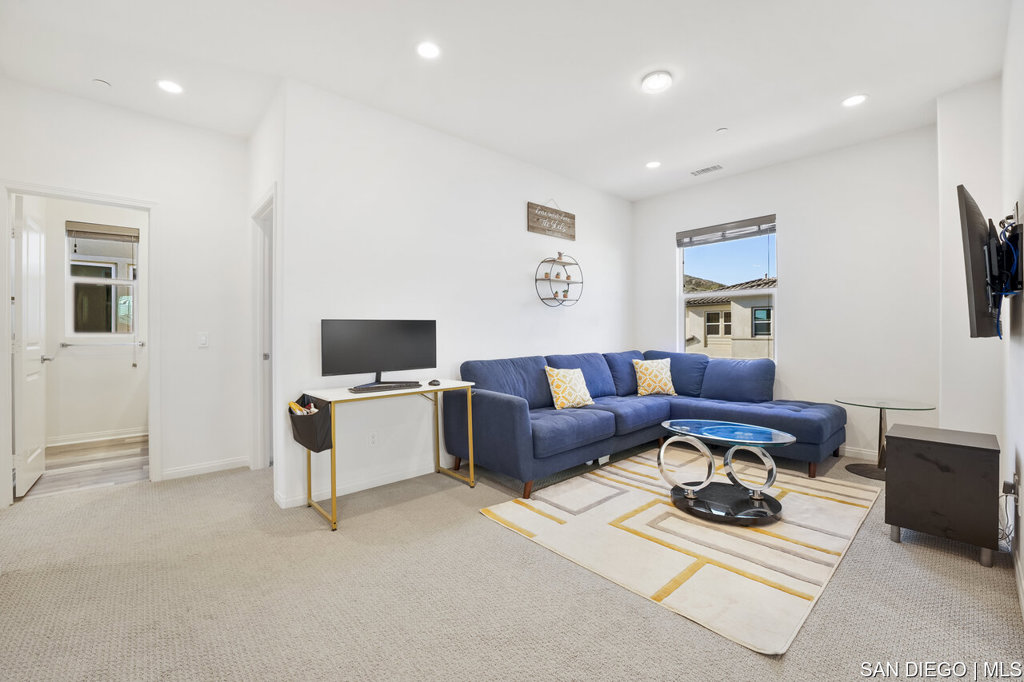 8615 Chaparral Way Santee, CA 92071 - Photo 19 of 46 a living room with furniture and a flat screen tv