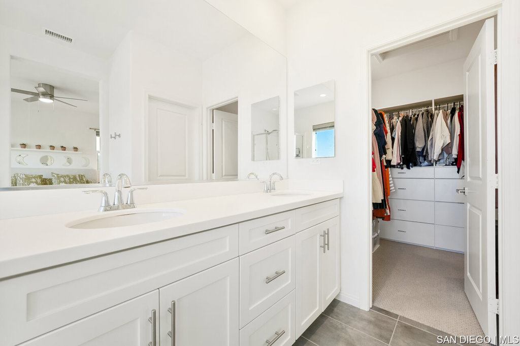 8615 Chaparral Way Santee, CA 92071 - Photo 26 of 46 a bathroom with a sink and a mirror