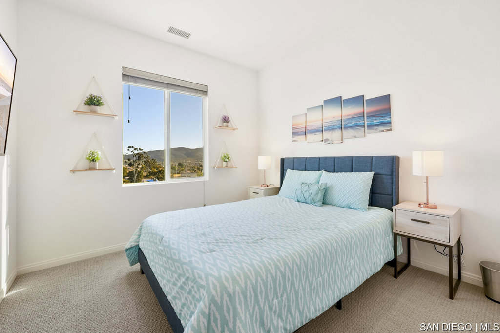 8615 Chaparral Way Santee, CA 92071 - Photo 28 of 46 a bedroom with a bed and a window