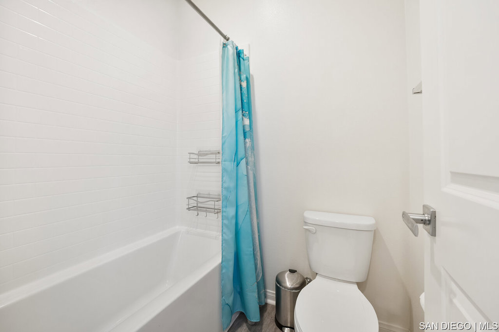 8615 Chaparral Way Santee, CA 92071 - Photo 31 of 46 a white toilet sitting next to a bath tub