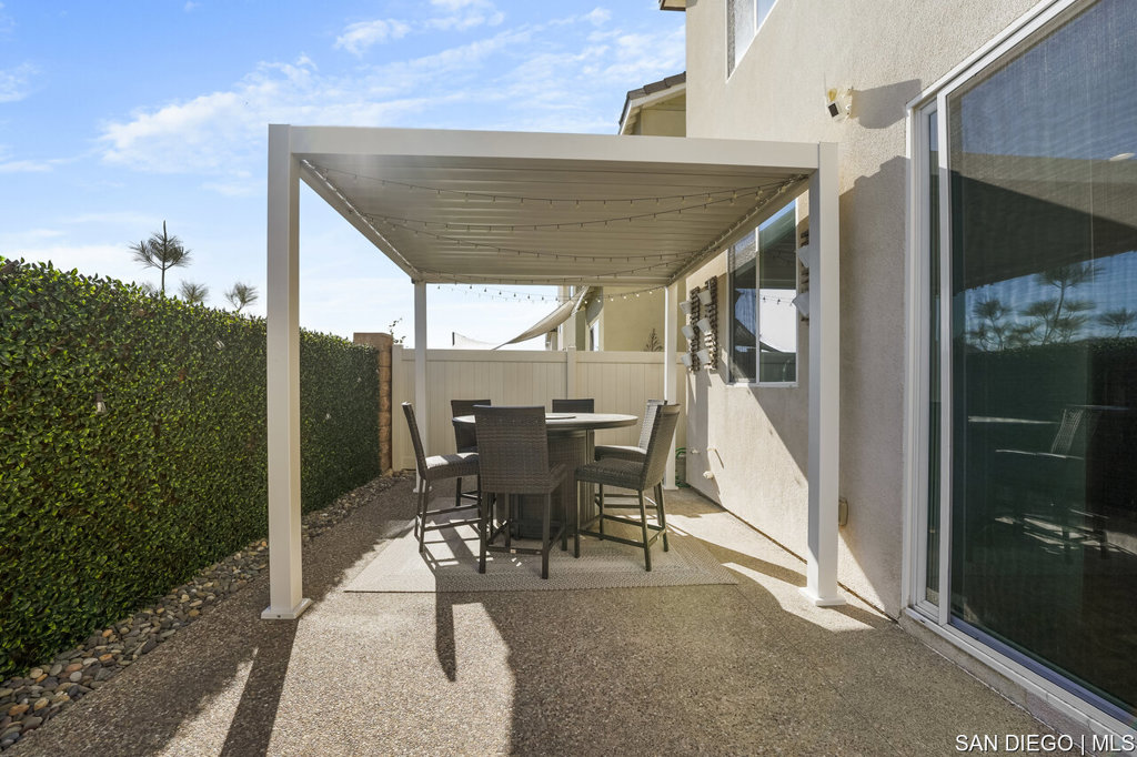 8615 Chaparral Way Santee, CA 92071 - Photo 37 of 46 a patio with table and chairs