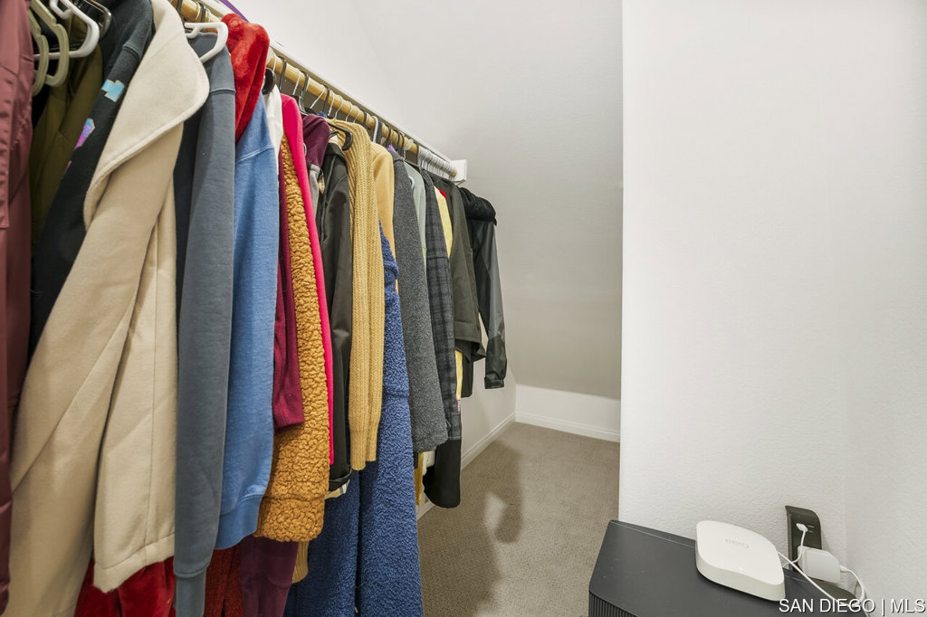 8615 Chaparral Way Santee, CA 92071 - Photo 6 of 46 a view of walk in closet with clothes and shoes
