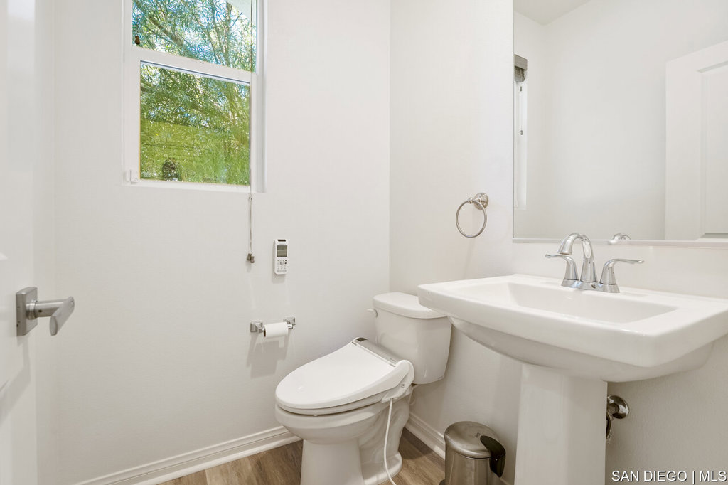 8615 Chaparral Way Santee, CA 92071 - Photo 7 of 46 a bathroom with a toilet sink and mirror