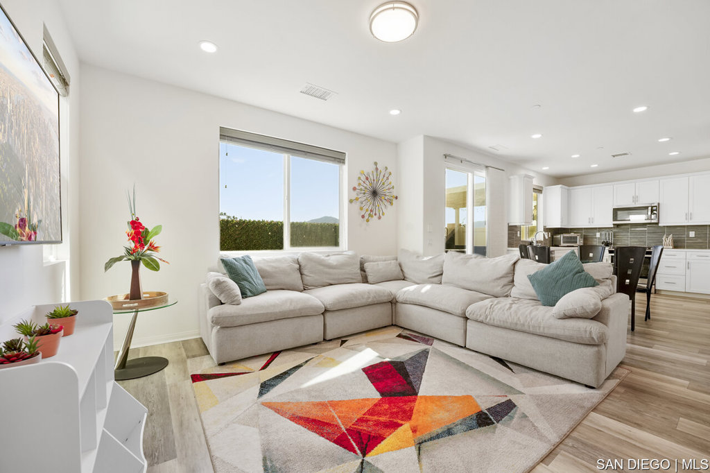 8615 Chaparral Way Santee, CA 92071 - Photo 10 of 46 a living room with furniture kitchen and a window