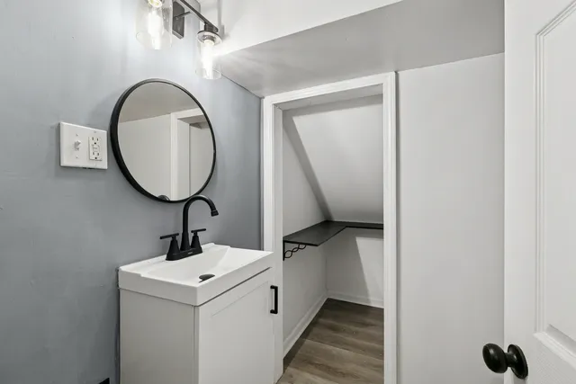 a view of wooden floor and entryway in a room
