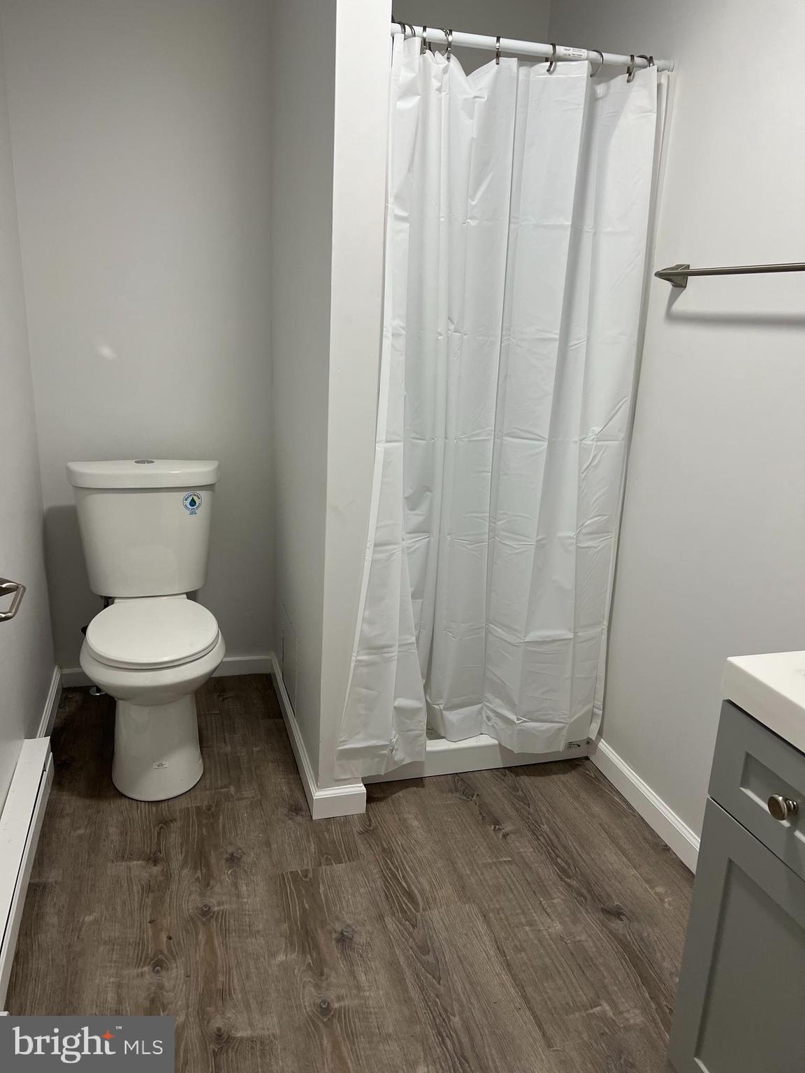 232 Center Street, Unit 1 Kennett Square, PA 19348 - Photo 4 of 7 a bathroom with a toilet and a shower
