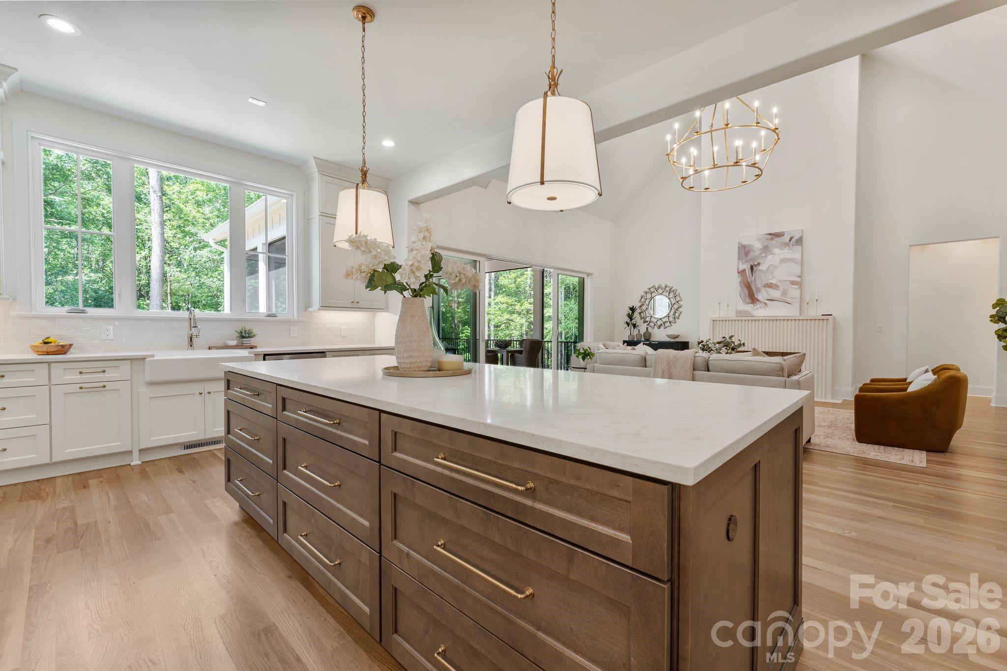 8016 Gulf Crk Road Lancaster, SC 29720 - Photo 18 of 48 a kitchen with a sink dishwasher a large island with wooden floor