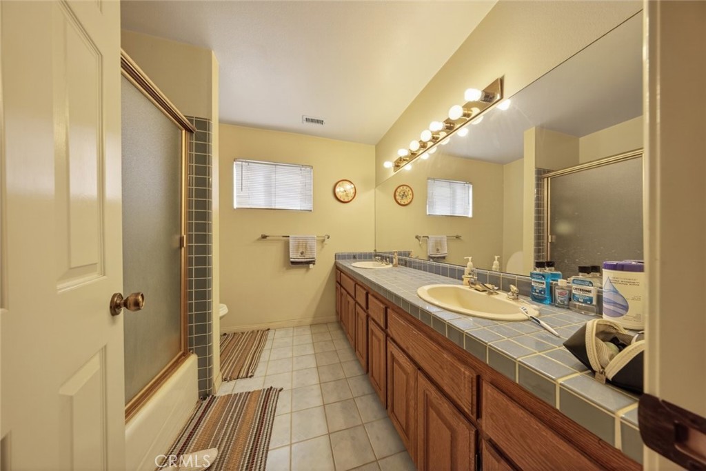 1978 Starvale Road Glendale, CA 91207 - Photo 18 of 75 a spacious bathroom with a double vanity sink a mirror and a shower