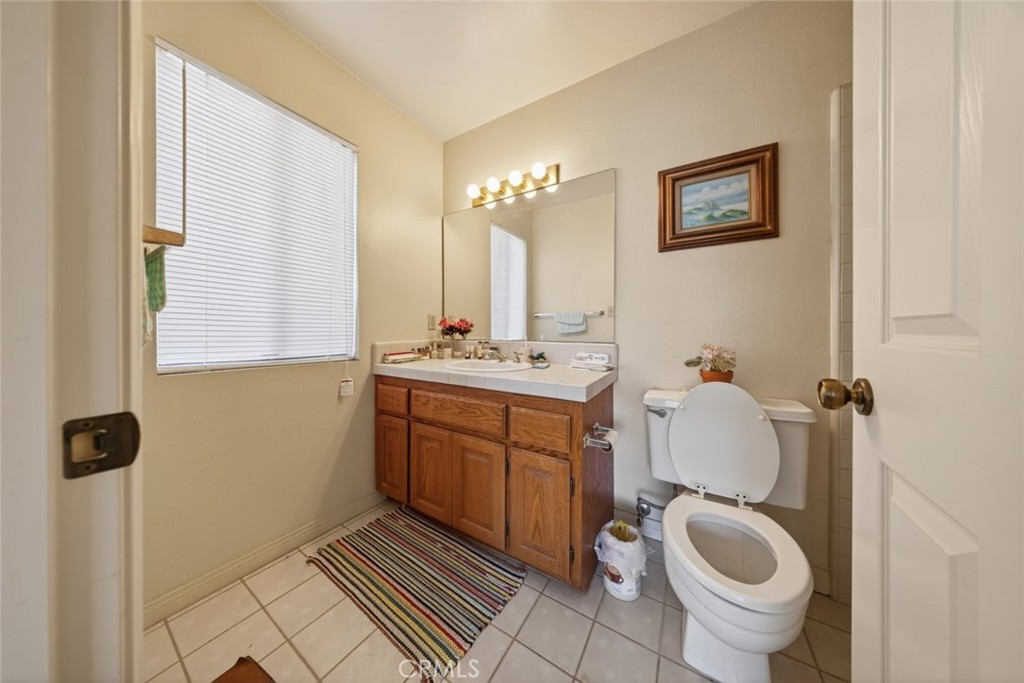 1978 Starvale Road Glendale, CA 91207 - Photo 32 of 75 a bathroom with a toilet a sink and mirror
