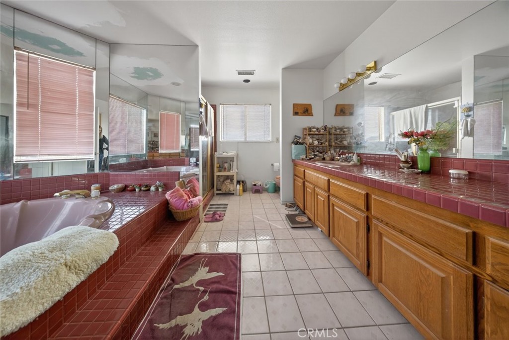 1978 Starvale Road Glendale, CA 91207 - Photo 40 of 75 a large bathroom with a double vanity sink a mirror and a bathtub
