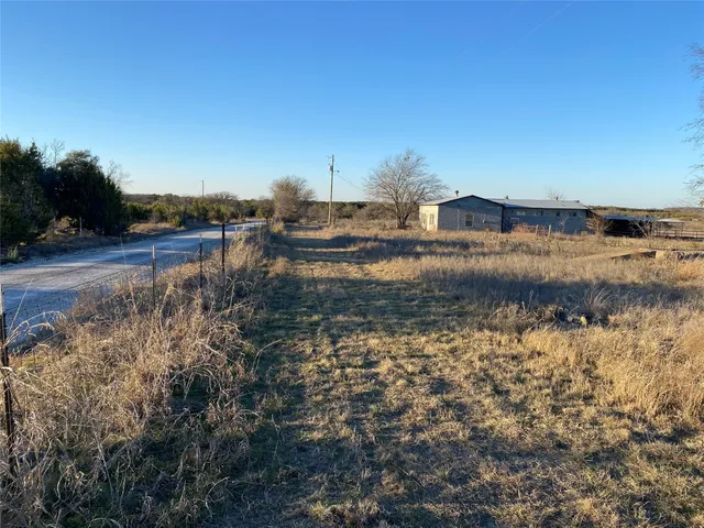 a view of a yard and ocean view