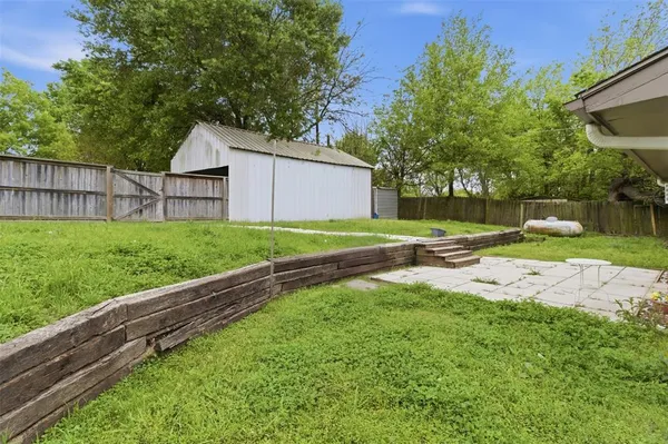 a view of a backyard with a garden